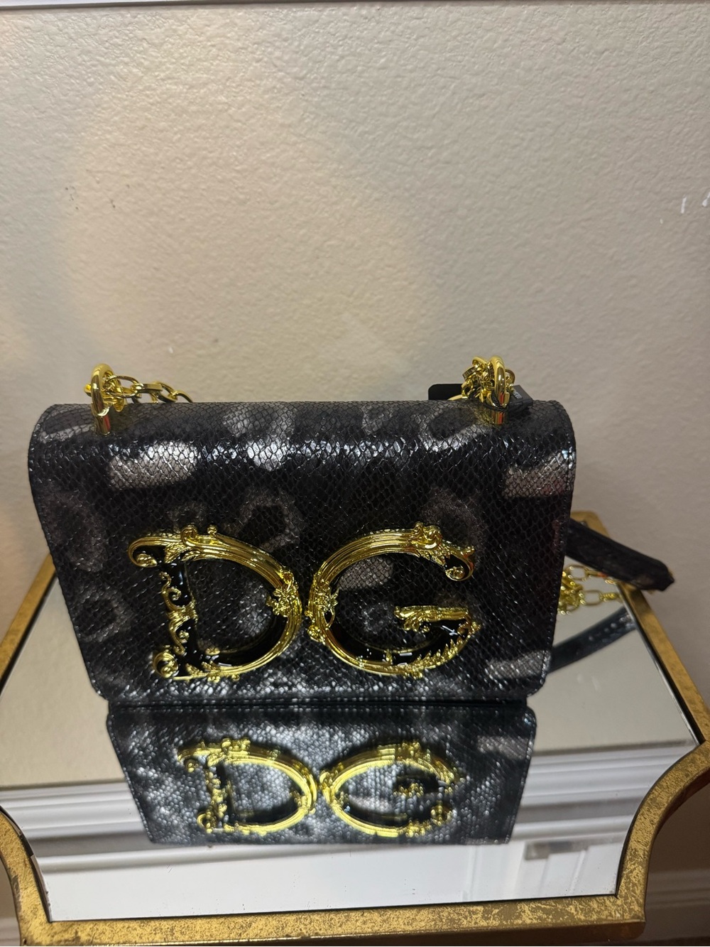 Black Snake-Embossed Crossbody Bag with Gold Hardware